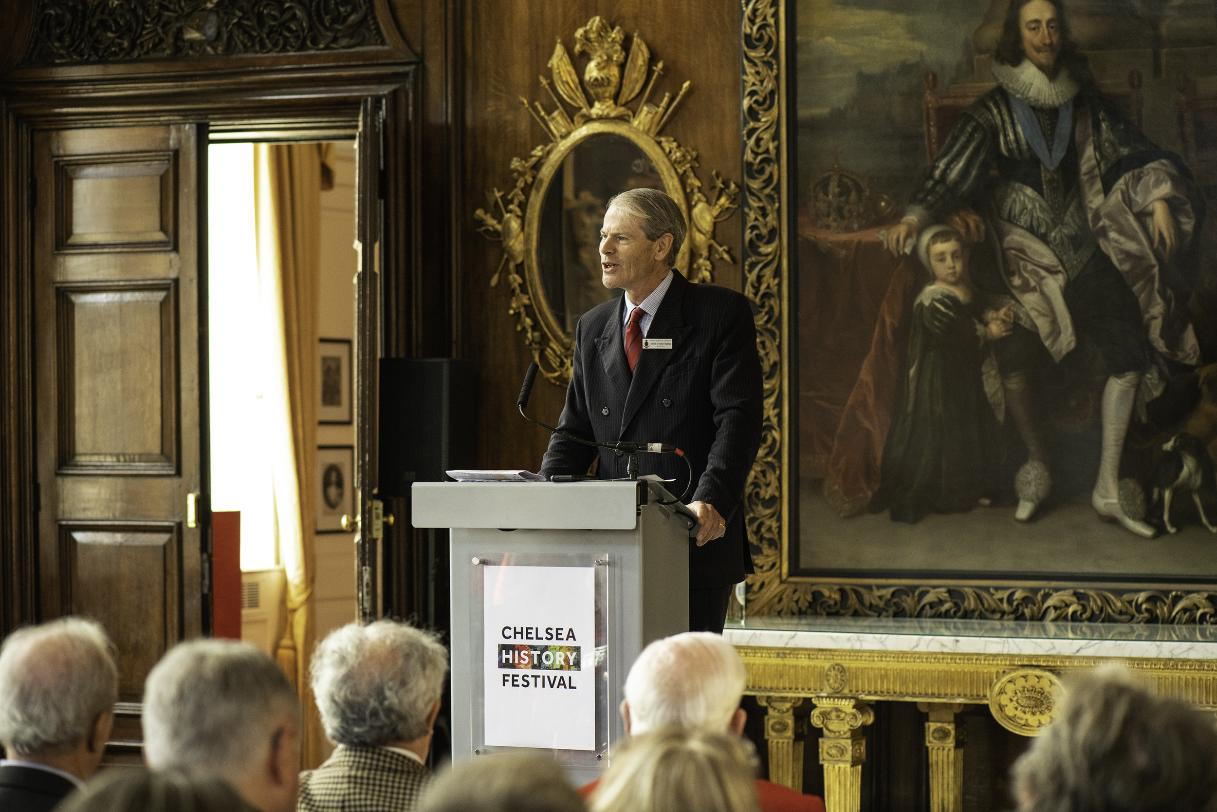 Governor of the Royal Hospital Chelsea on stage delivering a speech