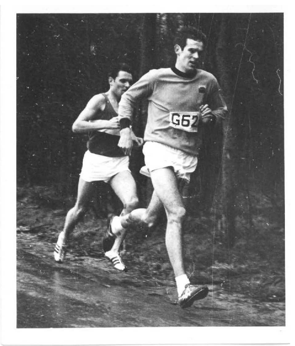 Black and white photo of Mick Gue running during his Army career