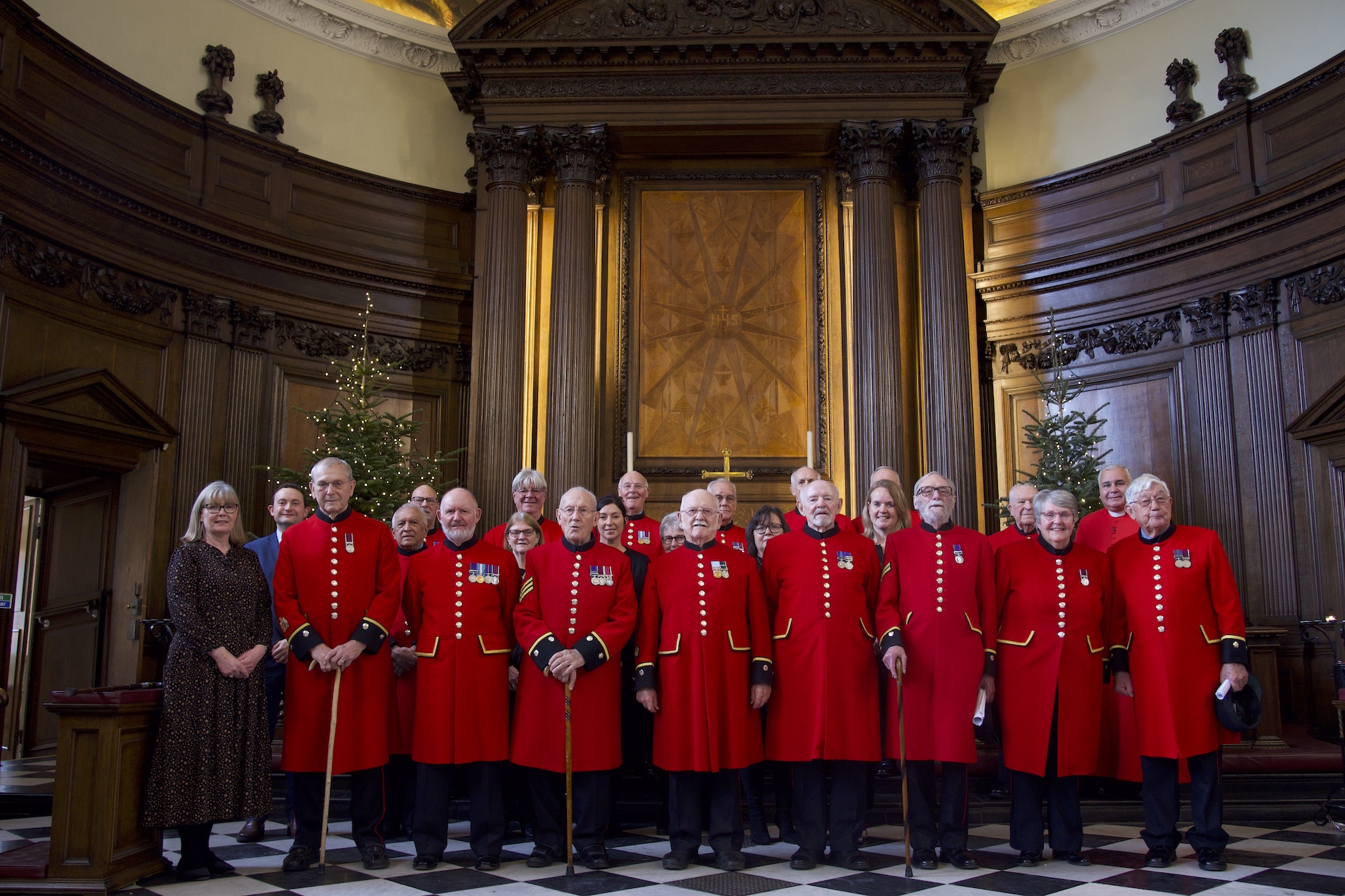 Chelsea Pensioner Singing Group in Scarlet uniform stood in the chapel