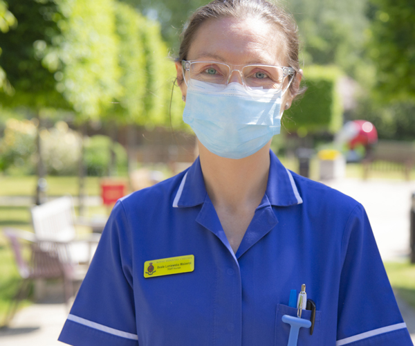 Staff Nurse - Beata wearing a facemask