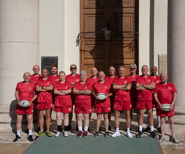 The Royal Hospital Chelsea's walking rugby team stood in front of the Royal Hospital building