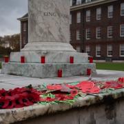 Wreaths made by school children laid at the foot of King Charles II statue