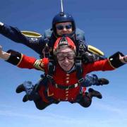 Pensioner Charmaine Coleman skydiving tandem in Scarlets