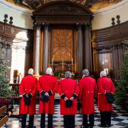 Chelsea Pensioners stood in a line in the chapel