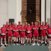 The Royal Hospital Chelsea's walking rugby team stood in front of the Royal Hospital building