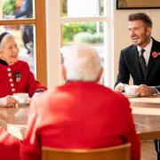 David Beckham joins the Chelsea Pensioners for tea.
